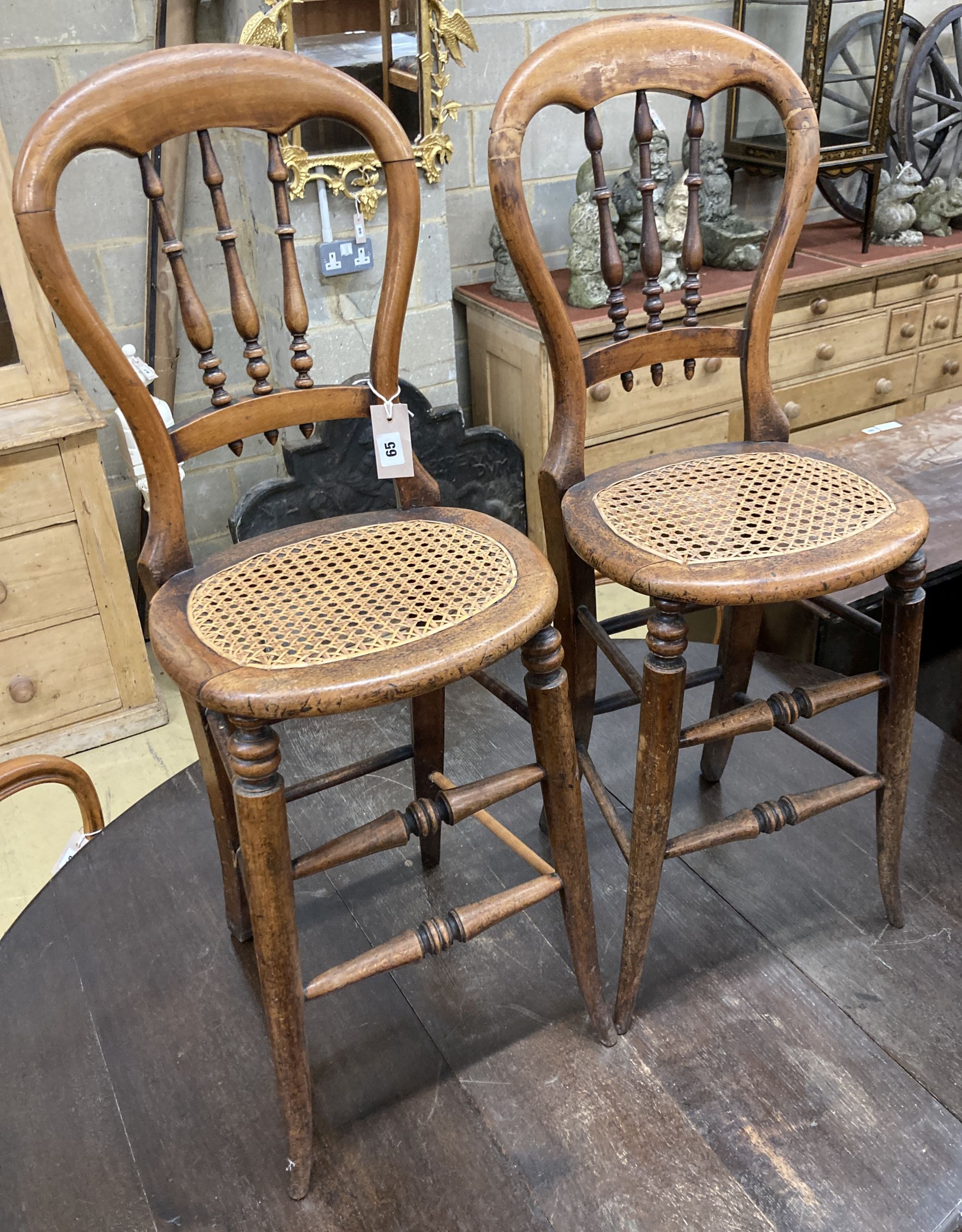 A pair of Victorian spindle back cane seat correction chairs